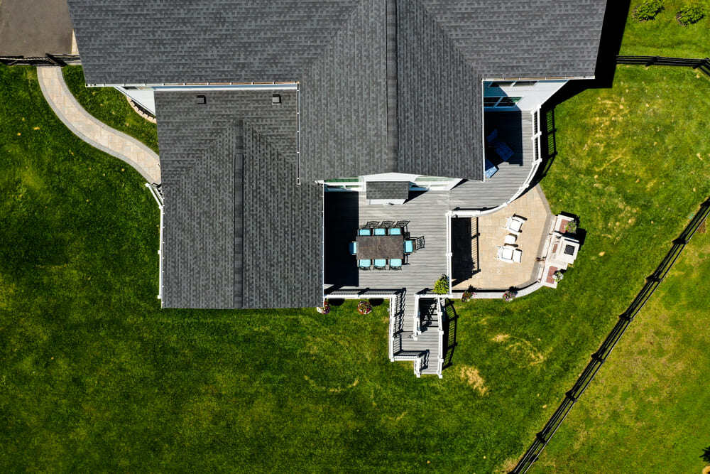 Drone view of deck, patio, and integrated walkway by Deckscapes of VA