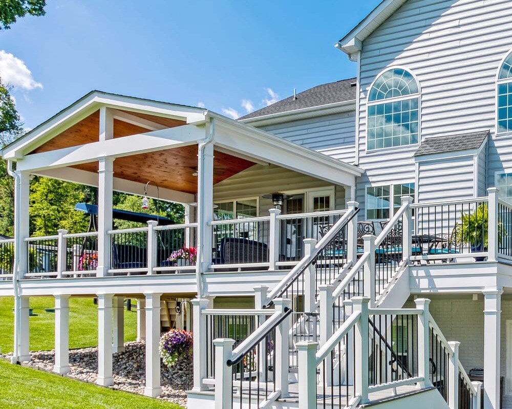 Raised deck with covered half space by Deckscapes of VA