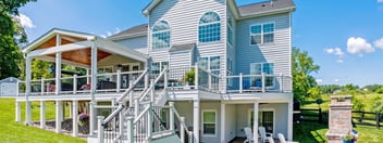 Raised deck with open porch by Deckscapes of Virginia