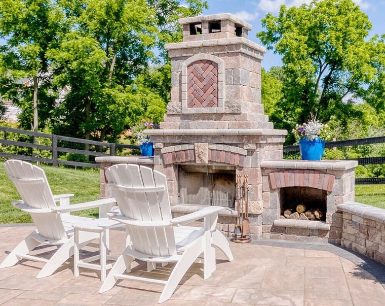 Unilock pavers and fireplace on patio by Deckscapes of VA