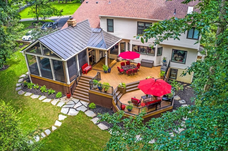 Beautiful Outdoor Backyard Oasis featuring Circular Porch, Screened In Area, Gorgeous Railing, and Steps by Deckscapes of VA