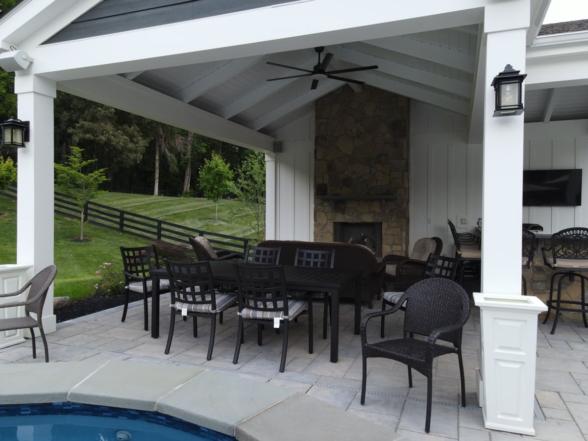 Close-up of a furnished pool house with fireplace in Northern Virginia