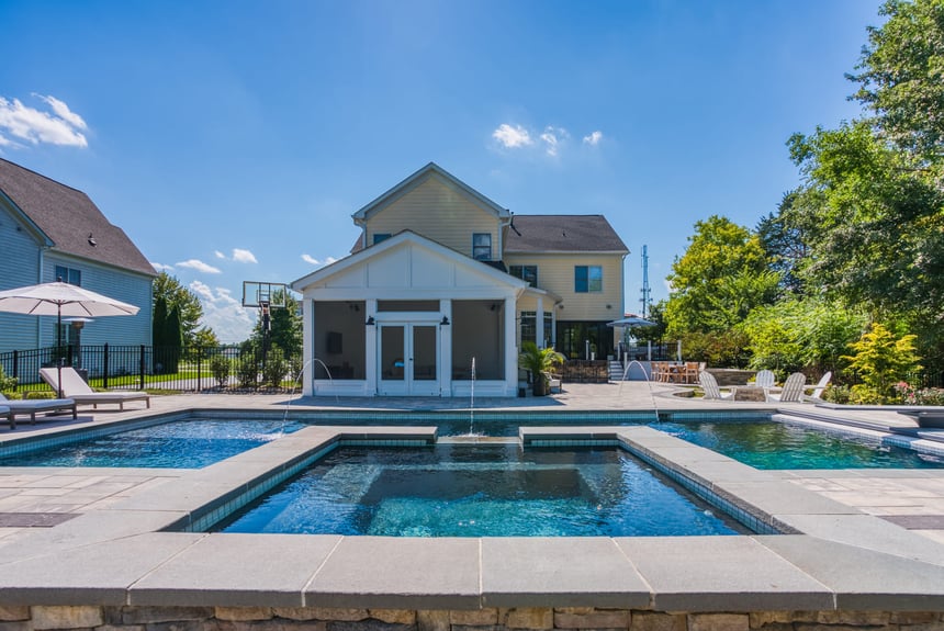 Custom hot tub attached to rectangular pool in Northern Virginia