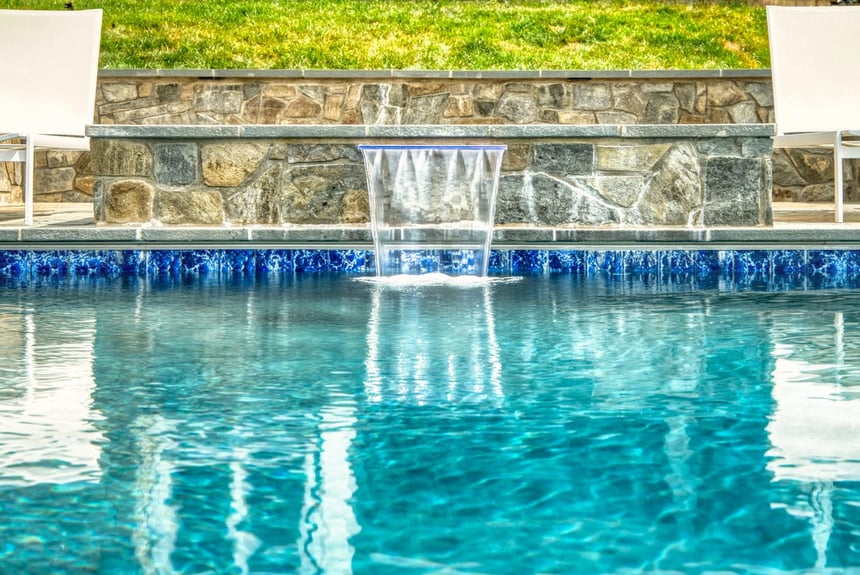 Custom stone waterfall feature on Northern Virginia pool