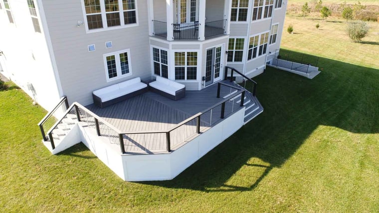 Luxury deck build with white siding and steps in northern virginia