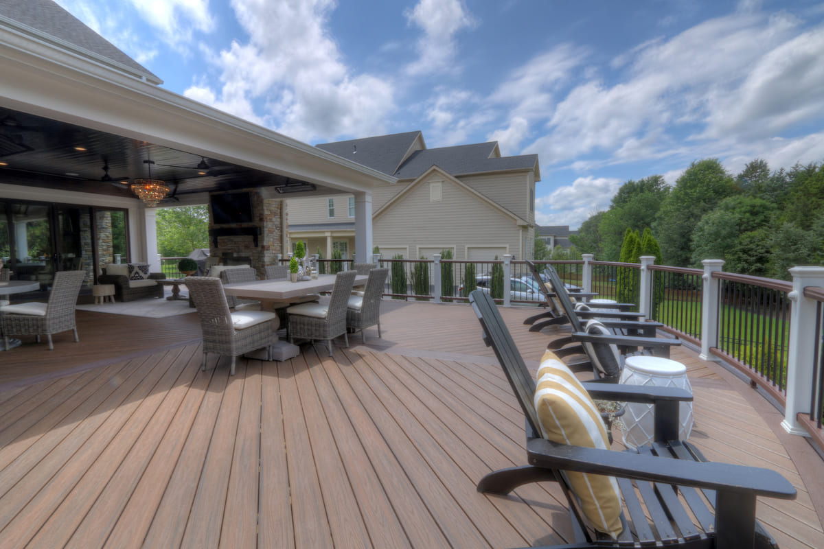 Deck project by Deckscapes of VA in Northern Virginia with a wooden deck featuring curved railing.