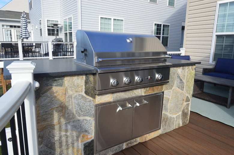 Stainless steel grill with stone surround and custom countertop