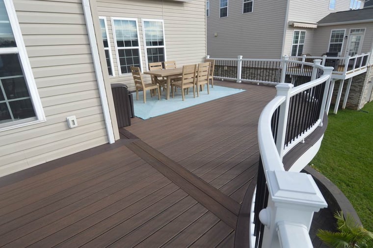 Brown composite decking with white deck posts