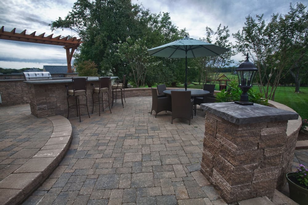 Patio and wall with outdoor kitchen and pergola