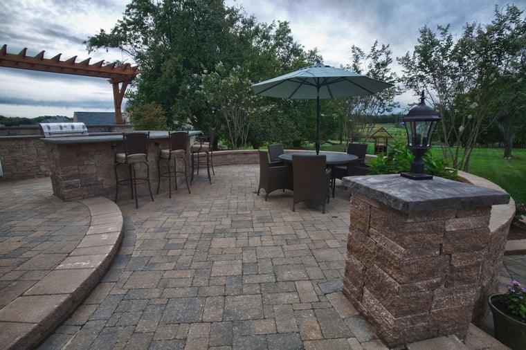 Patio and wall with outdoor kitchen and pergola
