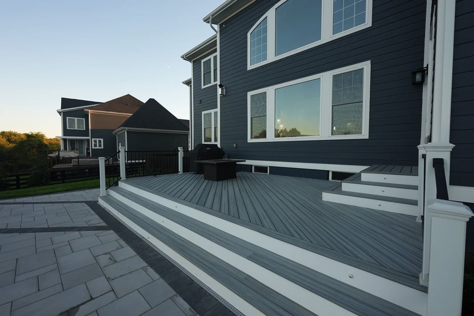 two-toned composite gray and white decking stairs into a patio in Virginia by Deckscapes