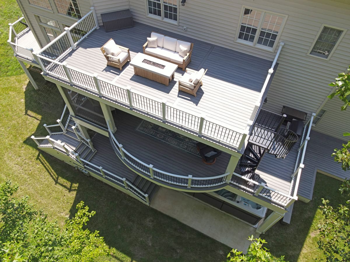 Drone view of multi-level deck with staircases between levels by Deckscapes of Virginia