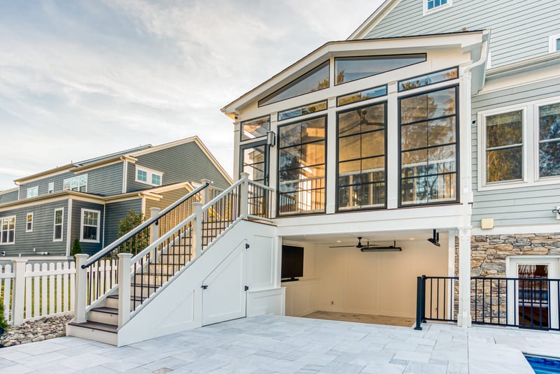 Elevated custom screened-in porch with under-deck space and steps to door in Northern VA