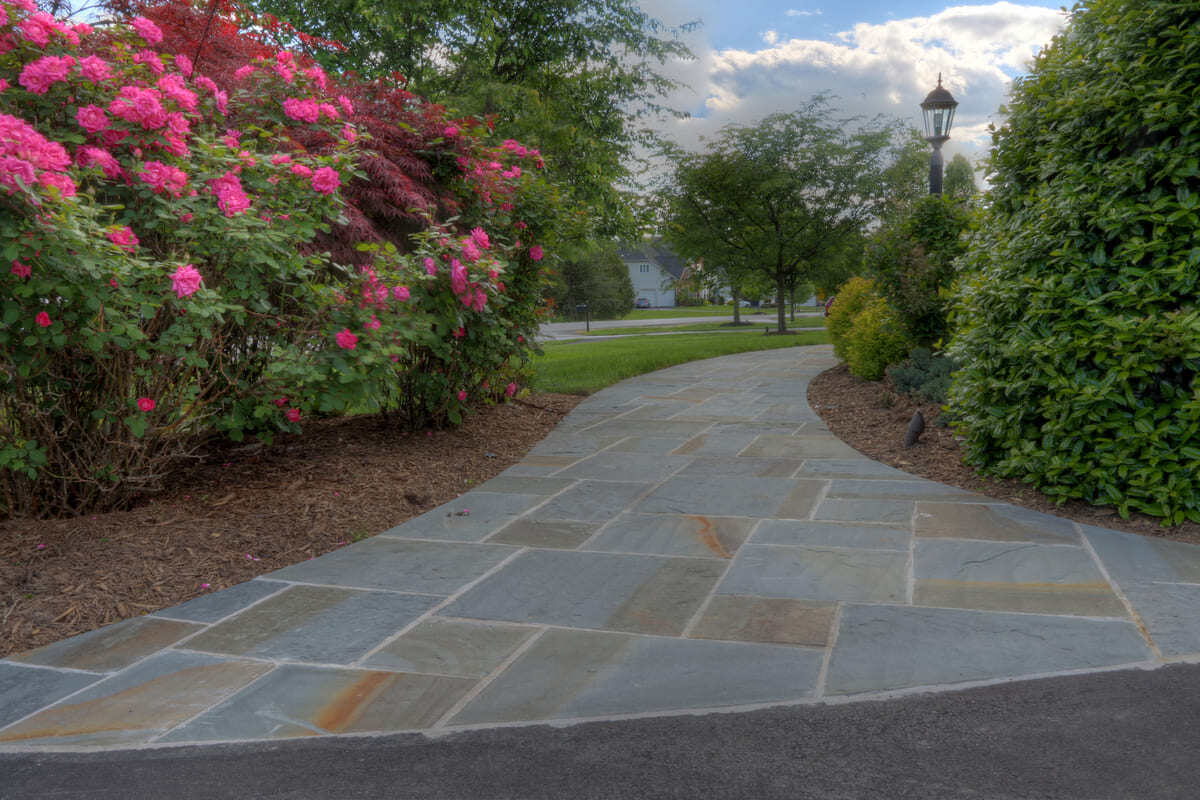 Flagstone walkway to backyard by Deckscapes of VA