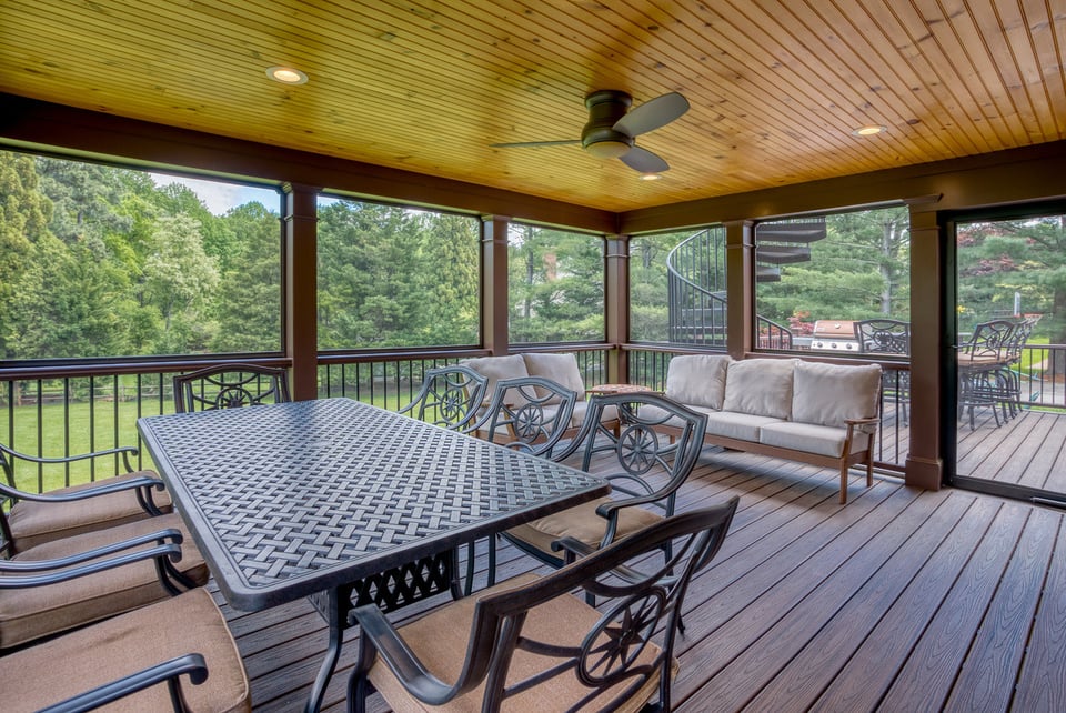 Screened-in porch on multi-level deck by Deckscapes of VA