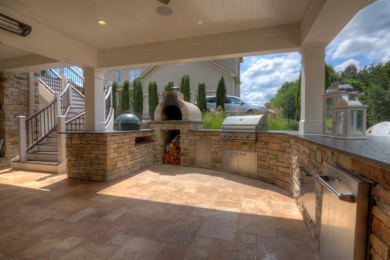 High-end outdoor kitchen by Deckscapes of Virginia with grill, smoker, and wood storage-1