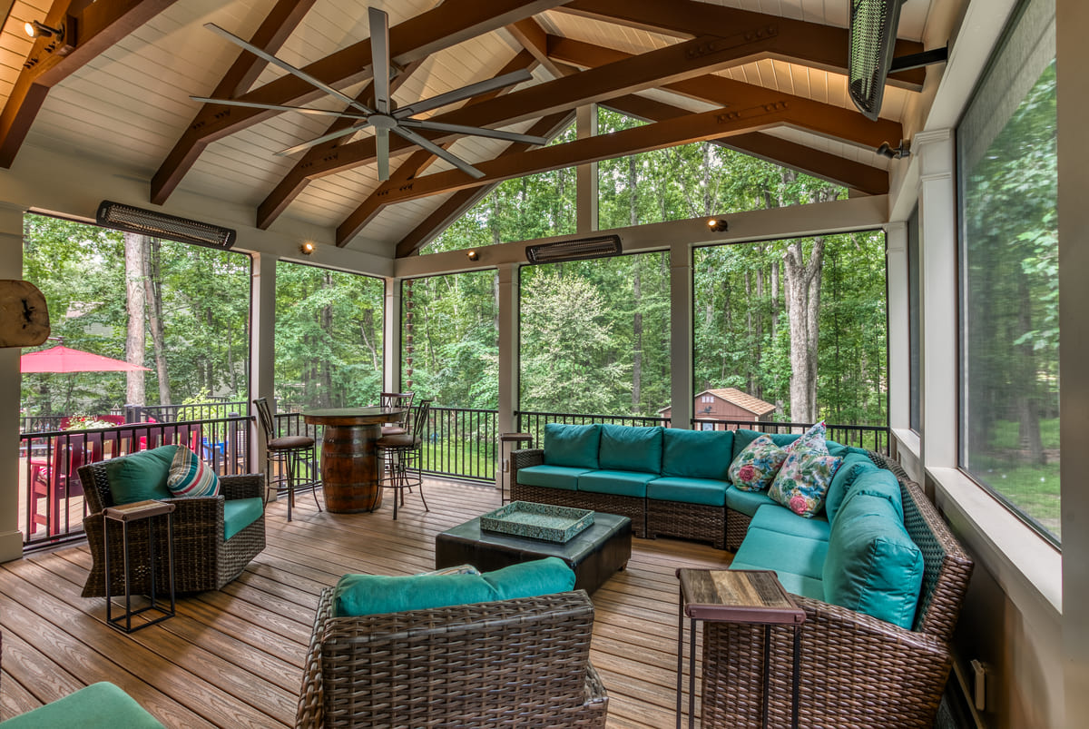 High-end screened-in porch interior with Bromic heaters and a-frame roof