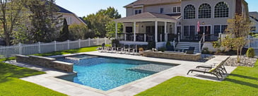 In-ground pool design with tanning ledge and view of deck and porch in Northern VA backyard