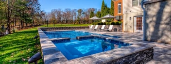 In-ground gunite pool in Northern VA by Deckscapes with hot tub