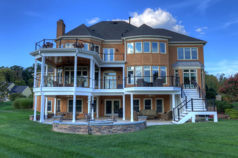 Leesburg, Virginia multi-level deck and patio on back of home with white staircase by Deckscapes