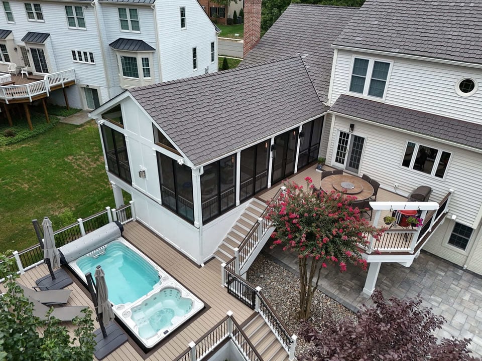 Drone view of deck and swim spa, patio, and screened-in porch by Deckscapes of VA