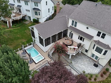 Multi-level deck with swim spa, patio, and screened-in porch by Deckscapes of VA