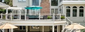 Multi-level deck with pergola and under deck living space by Deckscapes of Virginia