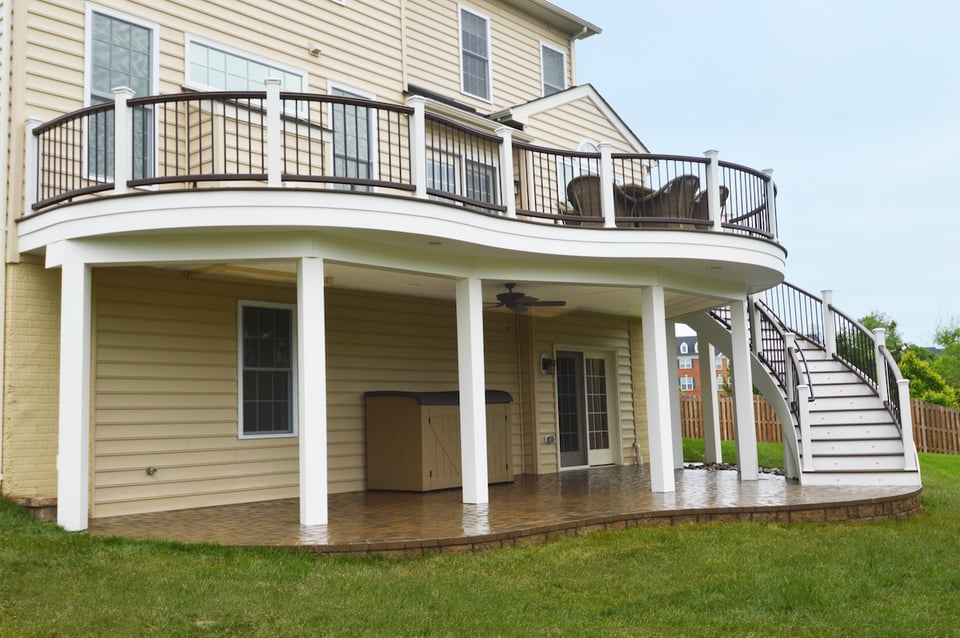 Curved two-story deck with staircase and covered patio in Northern Virginia