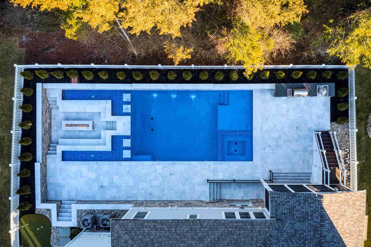 custom luxury pool aerial with lower level fireplace on the side in northern virginia-1