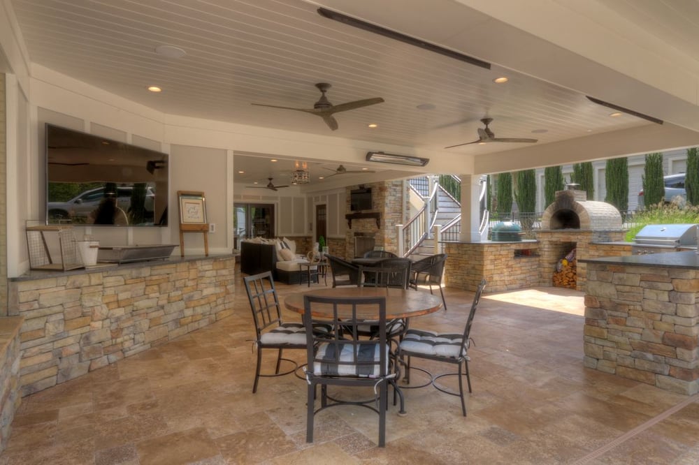 Patio and under deck with recessed lighting and kitchen