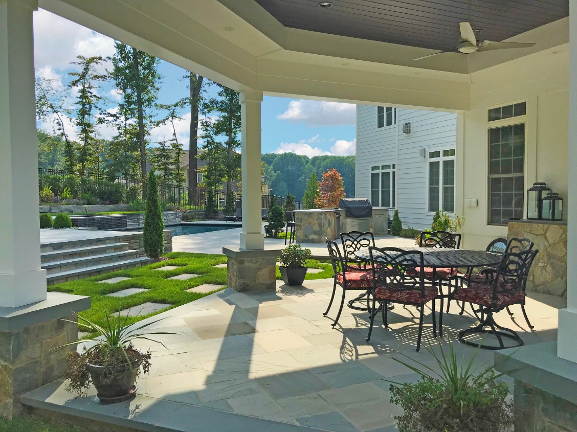 Custom pavilion with three-blade ceiling fan above table and chairs by Deckscapes of Virginia