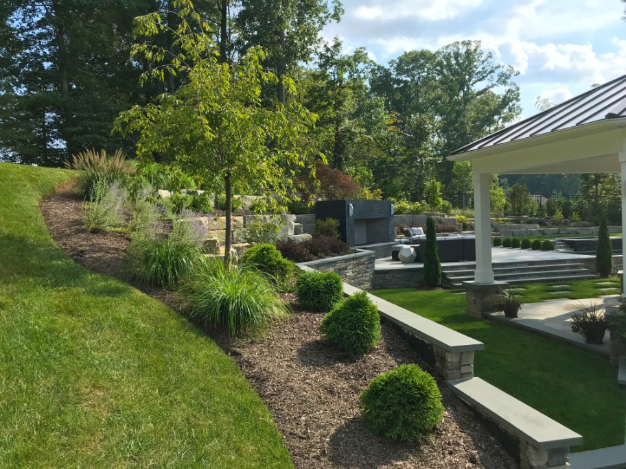 Landscaping design in Northern VA backyard with patio and pavilion by Deckscapes of Virginia