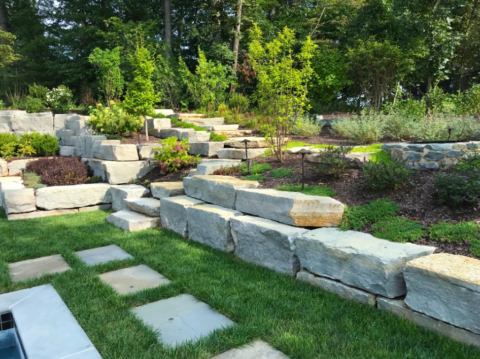 Landscaping with stone pathway and steps with lighting by Deckscapes of Virginia