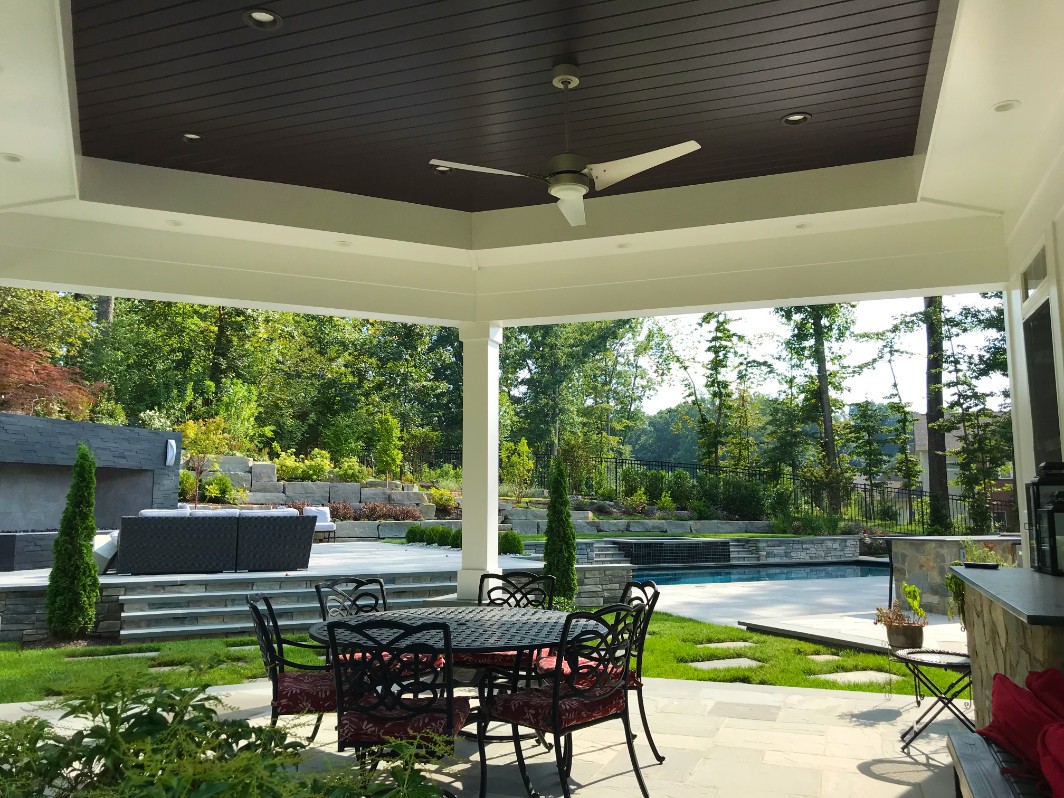 Outdoor Living Space Remodel in Northern Virginia by Deckscapes of VA featuring a covered patio area
