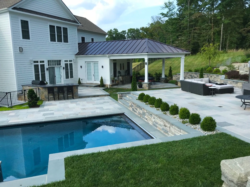 Pool and patio with landscaping design by Deckscapes of Virginia