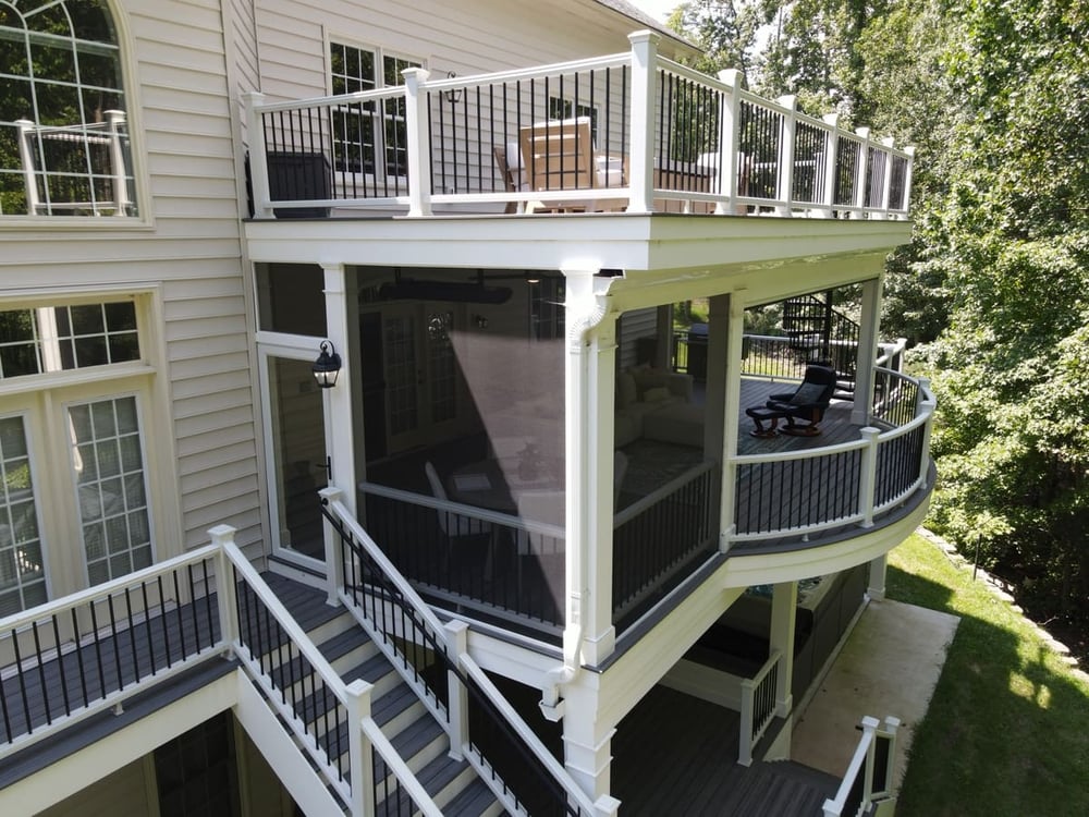 Exterior drone view of main story of Northern VA deck with screening