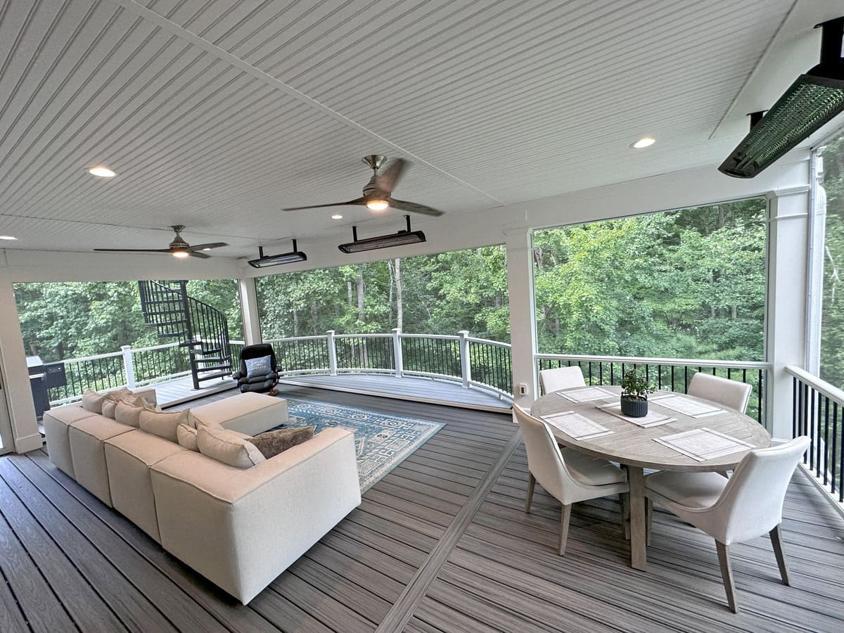 Main level of multi-story deck with ceiling fan and heaters by Deckscapes of Virginia