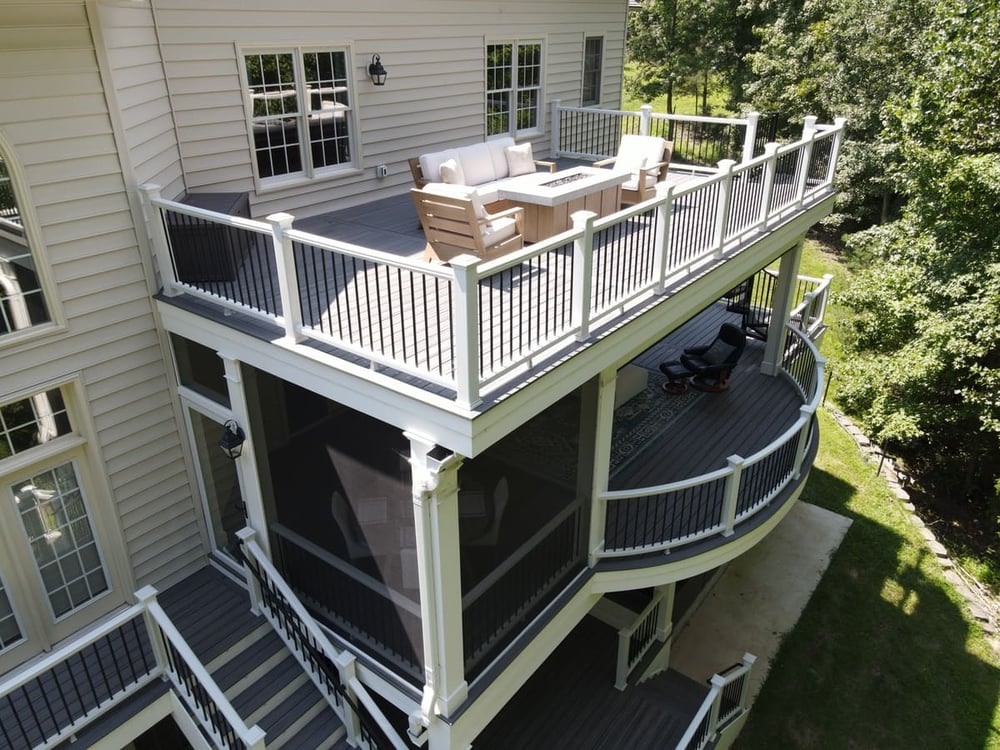 Triple level deck in Northern VA with wall lanterns and gutter system