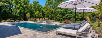 Rectangular pool with spa and water feature by Deckscapes of VA 