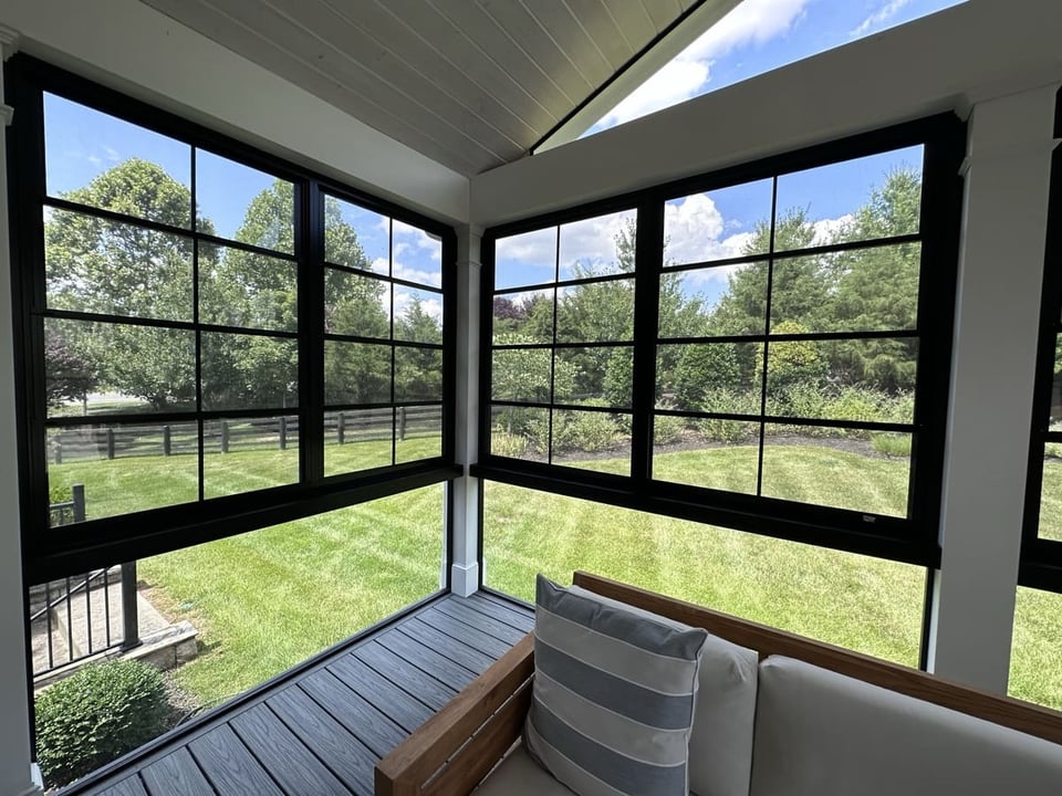 Retractable porch screens with black trim on Northern VA porch by Deckscapes of VA