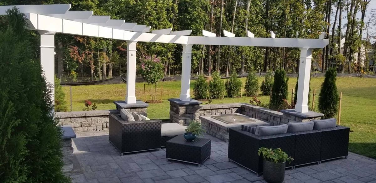 White pergola on patio with pivot feature in Northern VA
