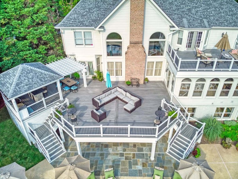 Aerial view of raised deck and attached porch with outdoor kitchen 