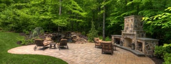 Backyard patio with custom stone fireplace