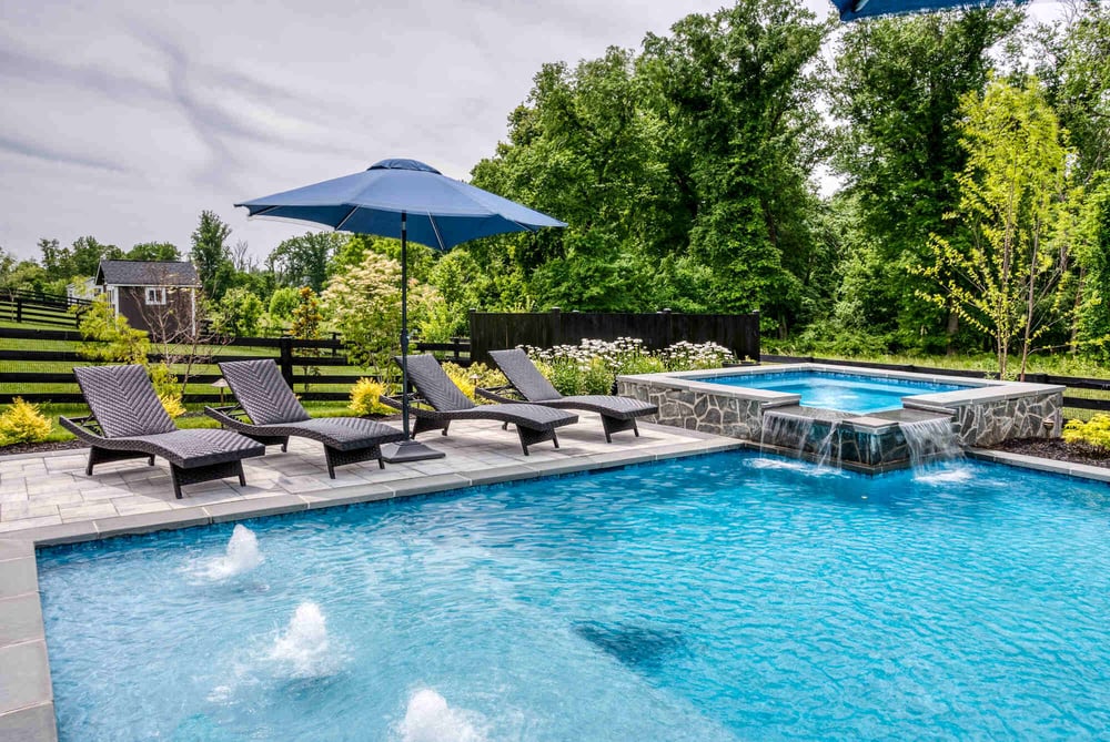 Custom in ground pool with hot tub waterfall in northern Virginia