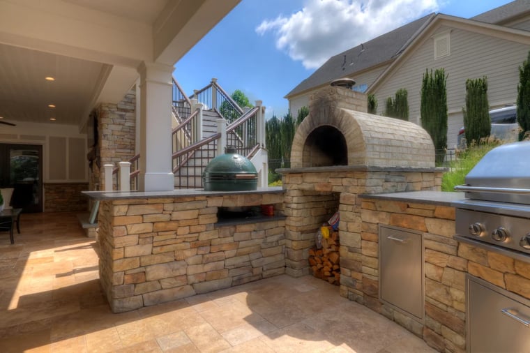 Custom outdoor kitchen and stairs with stone pizza oven