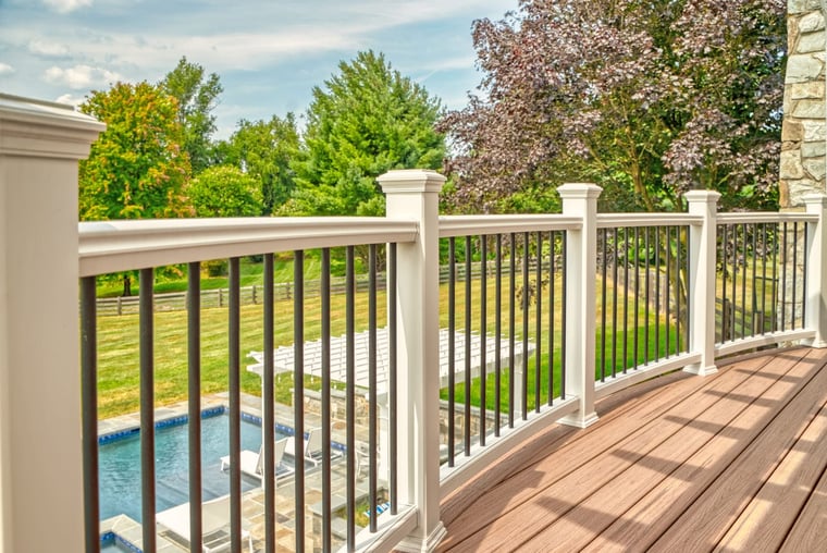 Custom raised deck railing with white posts