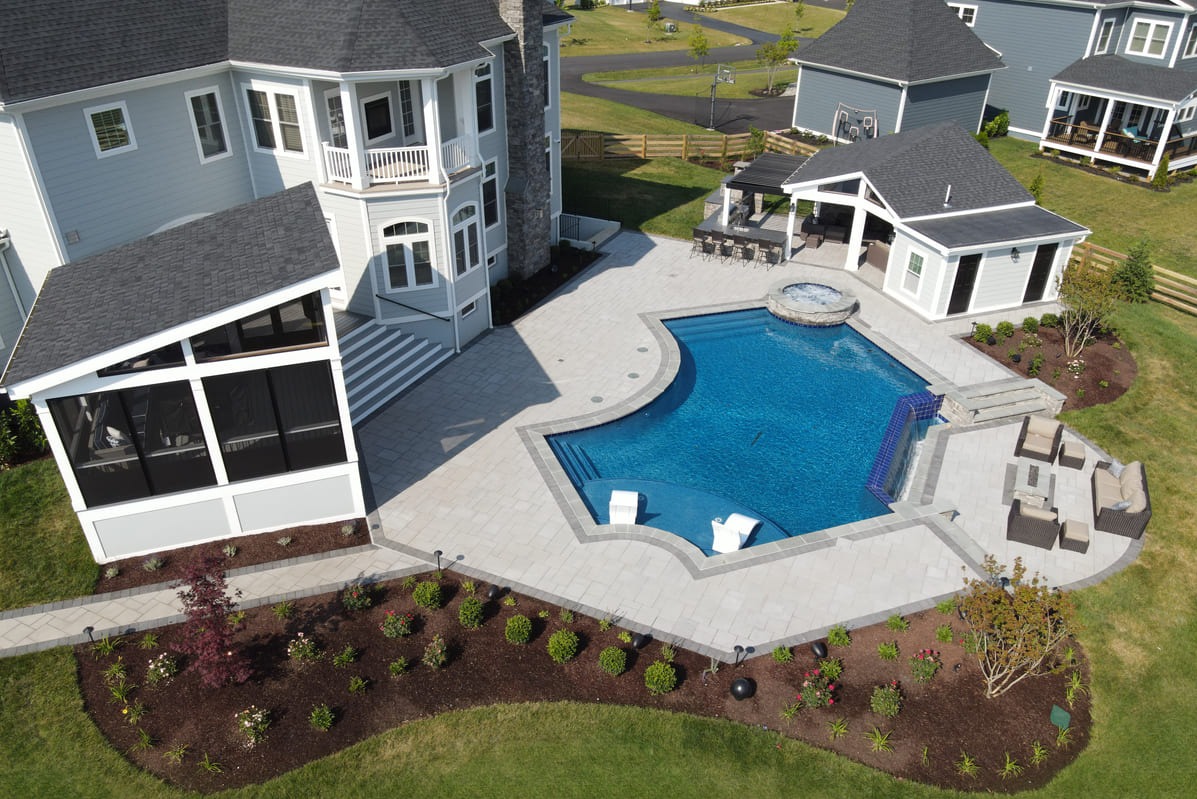 drone-view-of-screened-in-patio-and-pool-area-with-patio