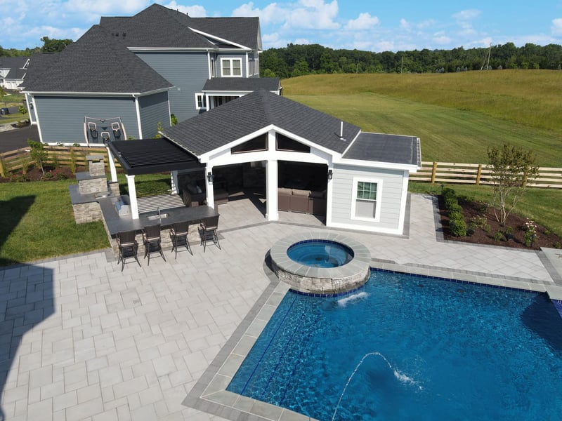 exterior of custom pool house with attached kitchen