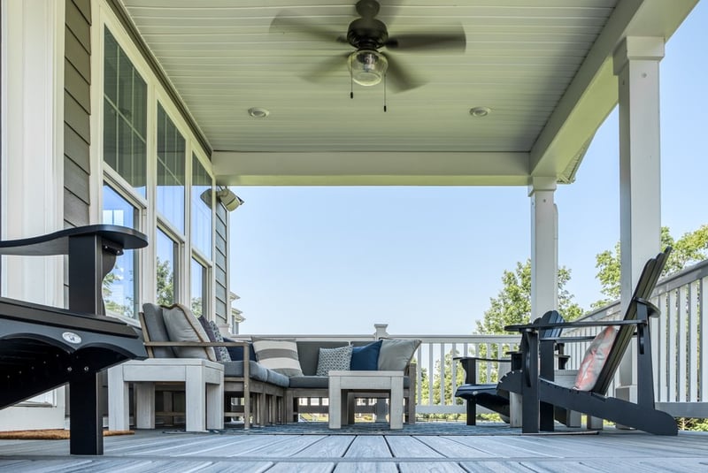 Front porch of home with outdoor furniture and ceiling fan