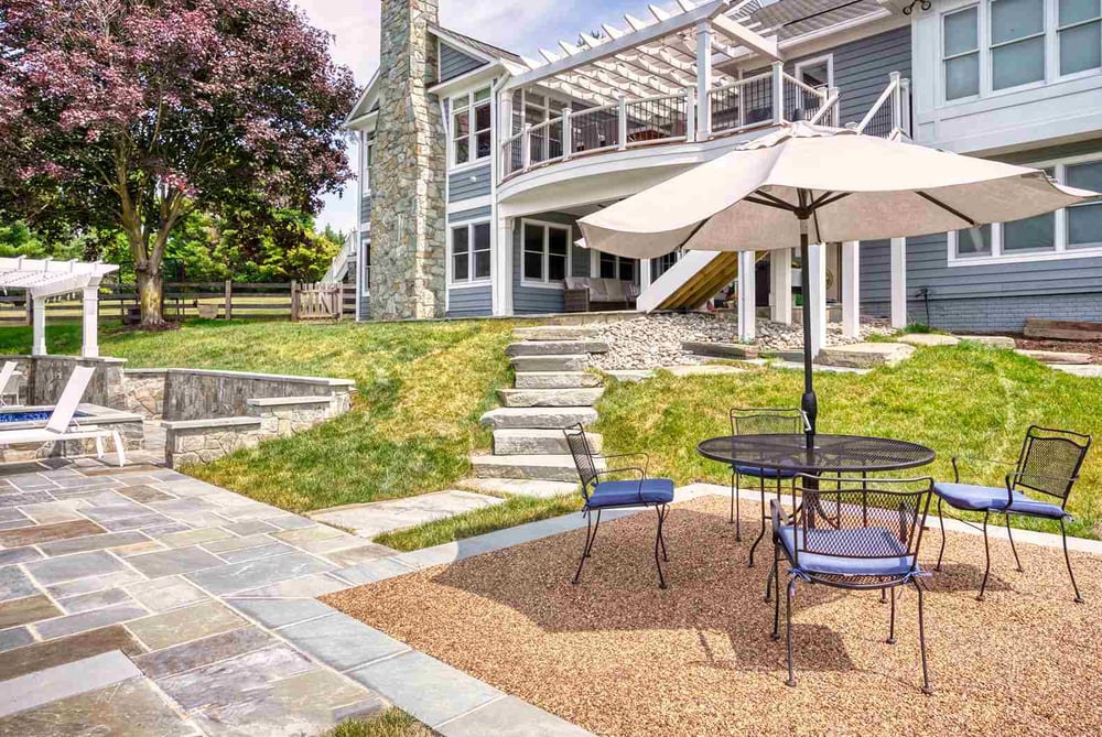 Natural stone patio finish with outdoor table and chairs